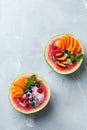 Healthy summer breakfast with fruit salad and yogurt in watermelon Royalty Free Stock Photo