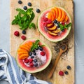 Healthy summer breakfast with fruit salad and yogurt in watermelon Royalty Free Stock Photo