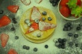 Healthy summer breakfast, homemade classic american pancakes with fresh berries and icing sugar. Blueberries and Royalty Free Stock Photo