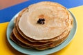 Healthy summer breakfast, homemade classic american pancakes with fresh blueornin berries. bright colorful background Royalty Free Stock Photo