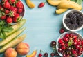 Healthy summer fruit variety. Sweet cherries, strawberries, blackberries, peaches, bananas, melon slices and mint leaves