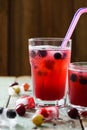 Healthy summer non alcoholic drink. Cherry sangria in glasses wi