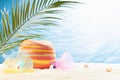 Healthy summer vacation and relax on tropical beach with sun hat, beach plays - badminton, slinky toy under palm leaves with sun. Royalty Free Stock Photo