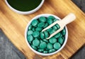 Healthy supplements - chlorella, spirulina algae powder and pills Royalty Free Stock Photo