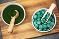 Healthy supplements - chlorella, spirulina algae powder and pills Royalty Free Stock Photo