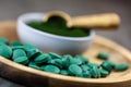 Healthy supplements - chlorella, spirulina algae powder and pills Royalty Free Stock Photo