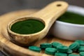 Healthy supplements - chlorella, spirulina algae powder and pills Royalty Free Stock Photo