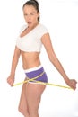 Healthy Surprised Fit Young Woman Checking Her Weight Loss With a Tape Measure