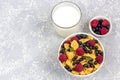 Healthy tasty breakfast: bowl with corn flakes and berries and glass of milk Royalty Free Stock Photo