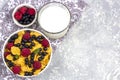 Healthy tasty breakfast: bowl with corn flakes and berries and glass of milk Royalty Free Stock Photo