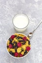 Healthy tasty breakfast: bowl with corn flakes and berries and glass of milk Royalty Free Stock Photo