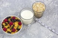 Healthy tasty breakfast with corn flakes and berries, a glass of milk and a glass of oatmeal Royalty Free Stock Photo