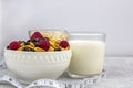 Healthy tasty breakfast with corn flakes and berries, a glass of milk and a glass of oatmeal Royalty Free Stock Photo