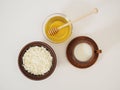 Healthy tasty breakfast in earthenware on a white background. Natural farm dairy products and fresh honey. Milk, cottage