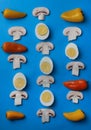 healthy tasty food eggs yellow orange pepper and chilli pepper lemon champignon and kenza mushrooms laid out in a pattern Royalty Free Stock Photo