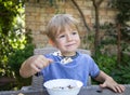 Healthy tasty food for kid. cute boy 4 years old has breakfast