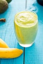 Healthy Tasty Green Avocado Shake or Smoothie, Made with Fresh Avocados, Banana, Milk on Blue Wooden Background, Raw Food Royalty Free Stock Photo