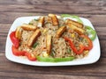 Healthy and tasty Paneer fried rice made of rice, mixed veggies and paneer, served in bowl over a rustic wooden background, Indo