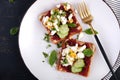 Healthy toast with pate beetroot, boiled eggs, basil and cucumbers.
