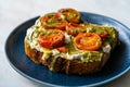 Healthy Toast Tartine with Cream Vegan Cashew Cheese Truffle Flavored, Pesto Sauce and Cherry Tomatoes Royalty Free Stock Photo