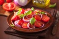 healthy tomato salad with onion basil olive oil and balsamic vinegar