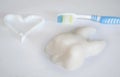 Healthy tooth with brush and toothpaste.