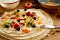 Healthy tropical fruit salad and cream in a wrap Royalty Free Stock Photo