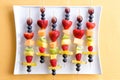 Healthy tropical summer fruit kebabs