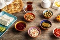 Healthy Turkish breakfast, with sliced tomato, cucumber, and white feta cheese, small bowls of strawberry jam, olive, honey, peppe Royalty Free Stock Photo