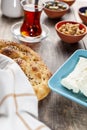 Healthy Turkish breakfast, with sliced tomato, cucumber, and white feta cheese, small bowls of strawberry jam, olive, honey, peppe Royalty Free Stock Photo