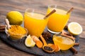 Healthy turmeric drink with honey, cinnamon, lemon and ginger