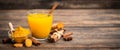 Healthy turmeric drink with honey, cinnamon, lemon and ginger Royalty Free Stock Photo