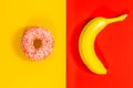 Healthy and unhealthy sugar, yellow-red background, Delicious banana and sweet donut, Concept of healthy eating, lifestyle