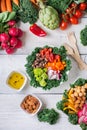 Healthy vegan buddha bowl with kale leaves and raw vegetables