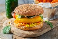 Healthy vegan burger with fresh vegetables and white sauce Royalty Free Stock Photo