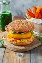 Healthy vegan burger with fresh vegetables and white sauce Royalty Free Stock Photo