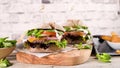 Healthy vegan burger with fresh vegetables and yogurt sauce on rustic kitchen counter top Royalty Free Stock Photo