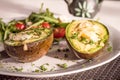 Healthy vegan dishes - avocado baked with egg