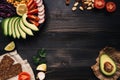 Healthy vegan food concept. Healthy food with vegetables and whole wheat bread on the wooden table top view. Copy space Royalty Free Stock Photo