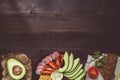 Healthy vegan food concept. Healthy food with vegetables and whole wheat bread on the wooden table top view. Copy space Royalty Free Stock Photo