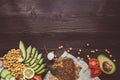 Healthy vegan food concept. Healthy food with vegetables and whole wheat bread on the wooden table top view. Copy space Royalty Free Stock Photo