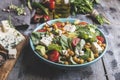 Healthy vegan salad with avocado ,beet leaves ,chickpea, broccoli ,tomato,blue cheese