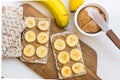 Healthy vegan snack with scandinavian rye crispbread, homemade peanut butter and slices of Canary bananas Royalty Free Stock Photo