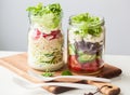 Healthy vegetable cheese salad in mason jars