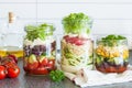 Healthy vegetable cheese salad in mason jars