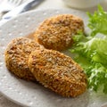 Healthy vegetable cutlets with carrot, dried apricots, almonds and herbs, breaded in oat bran