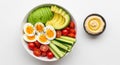 Healthy vegetable and egg salad bowl with avocado and hummus dip Royalty Free Stock Photo