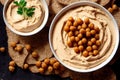 Healthy vegetable food in form of cooked chickpeas puree in deep bowls