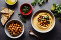 Healthy vegetable food in form of cooked chickpeas puree in deep bowls