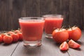 Healthy vegetable. Glass of red tomato juice on wooden table Royalty Free Stock Photo